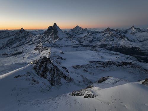 Aerial Shot of a Snow Covered Mountain area