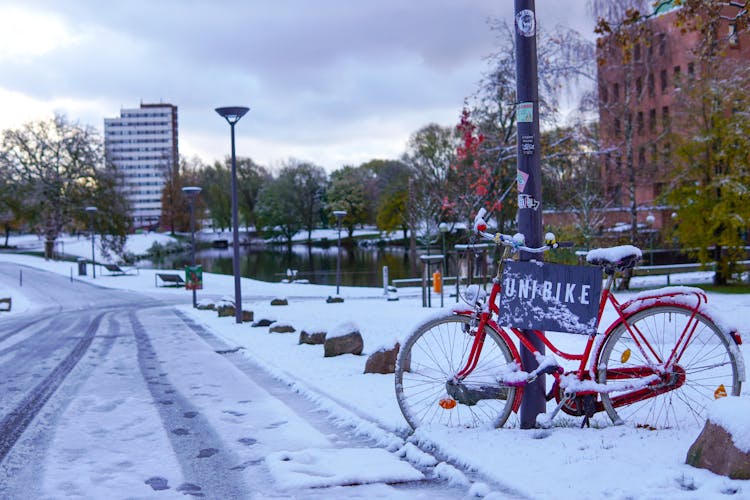 Red Bike Parked On Roadside