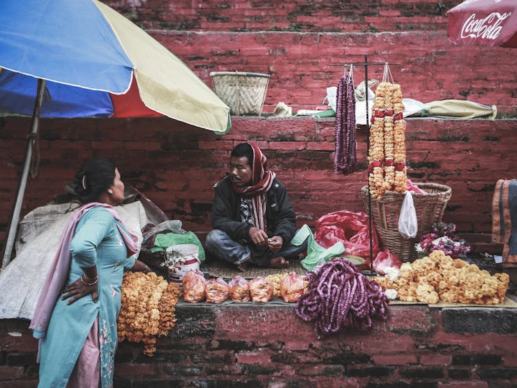 Man Selling Flowers In The Market