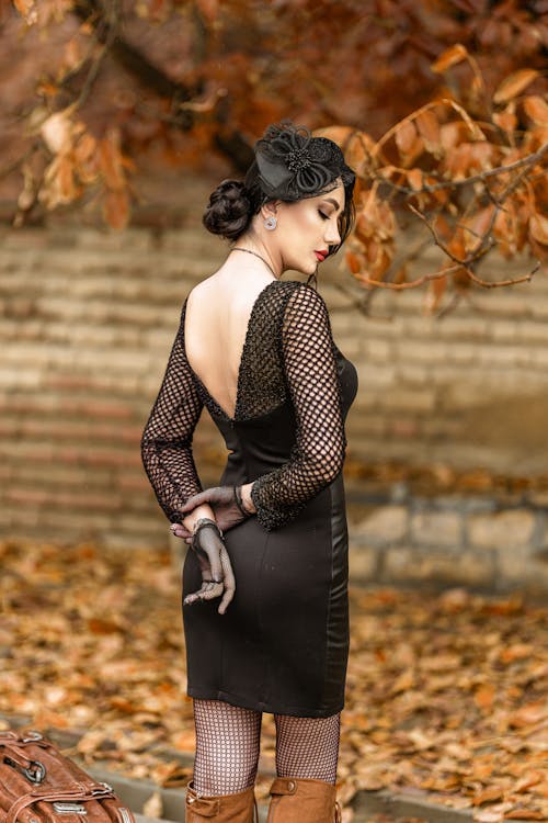 Beautiful Woman in Black Long Sleeve Dress