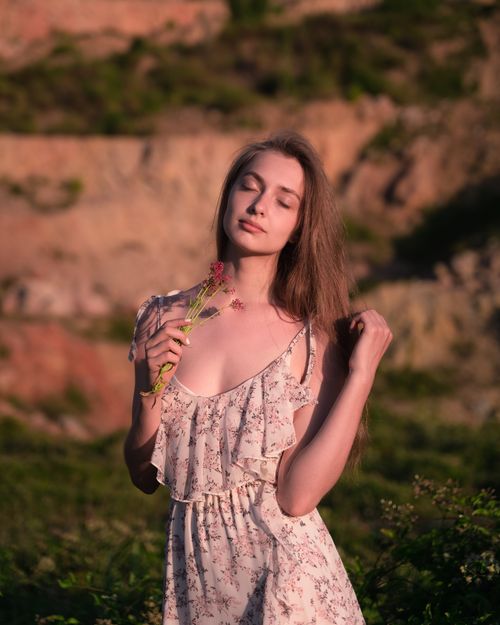 Free A serene portrait of a woman with closed eyes enjoying nature's tranquility. Stock Photo