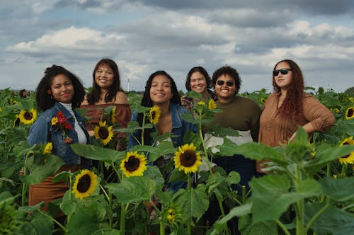 Women Standing in a Flower Field