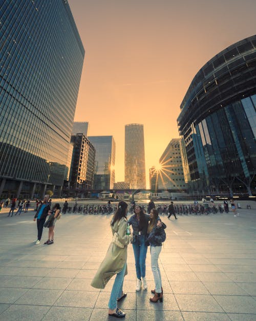 Free Women Meeting on City Street Stock Photo