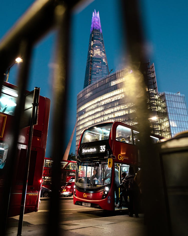 Double Decker Buses On The Road During Night Time