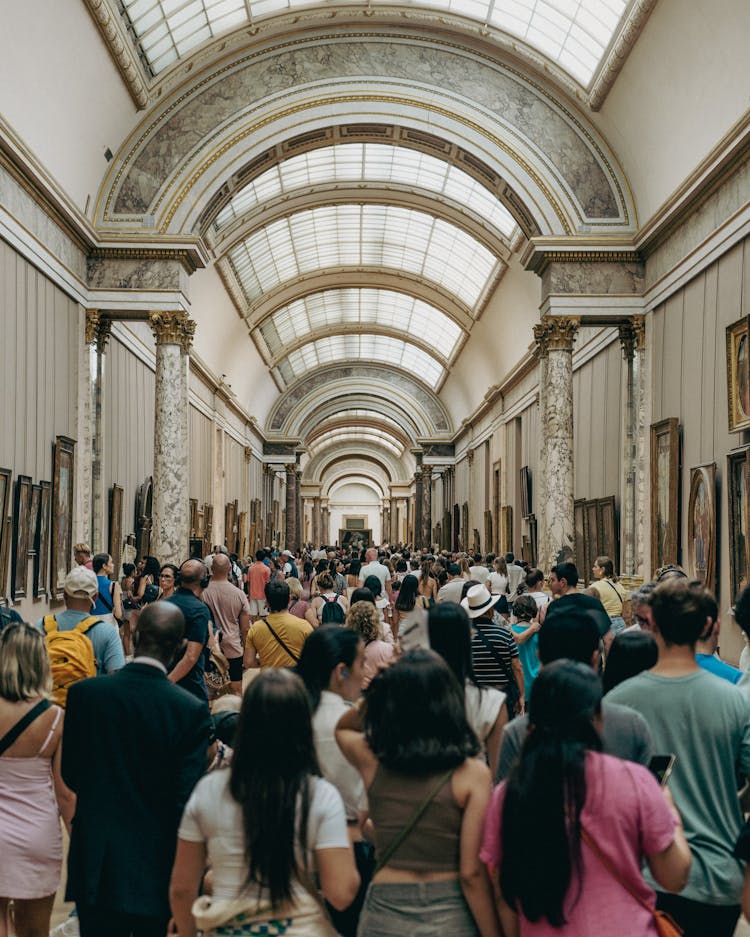 Crowd In Louvre