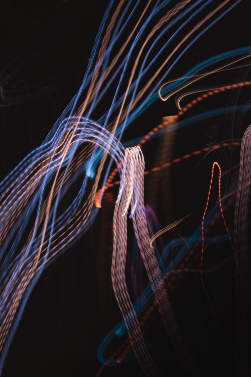 Free Vibrant and dynamic abstract light streaks against a dark background, capturing motion and energy. Stock Photo