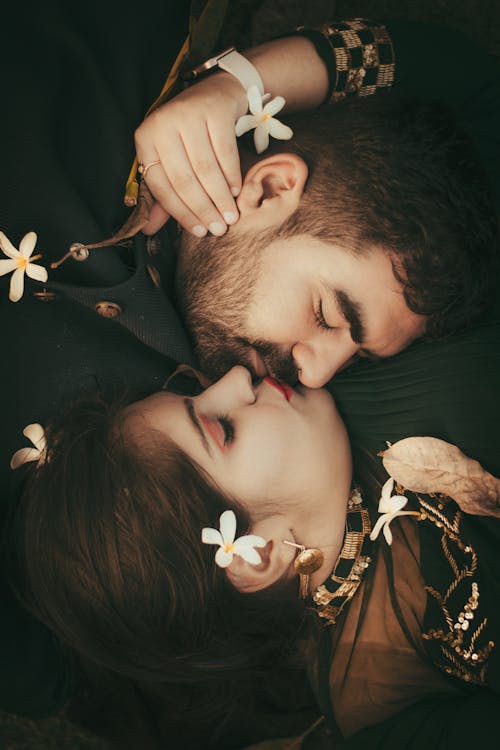 Faces of a Young Couple Kissing Each Other 