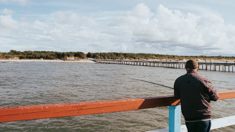 Photo Of A Man Fishing