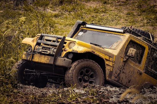 A Yellow SUV on the Mud 
