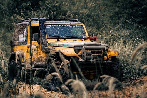 Free A Yellow SUV on the Dirt Road  Stock Photo
