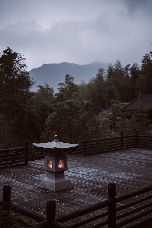 Lantern on a Wooden Terrace on Top of a Mountain 