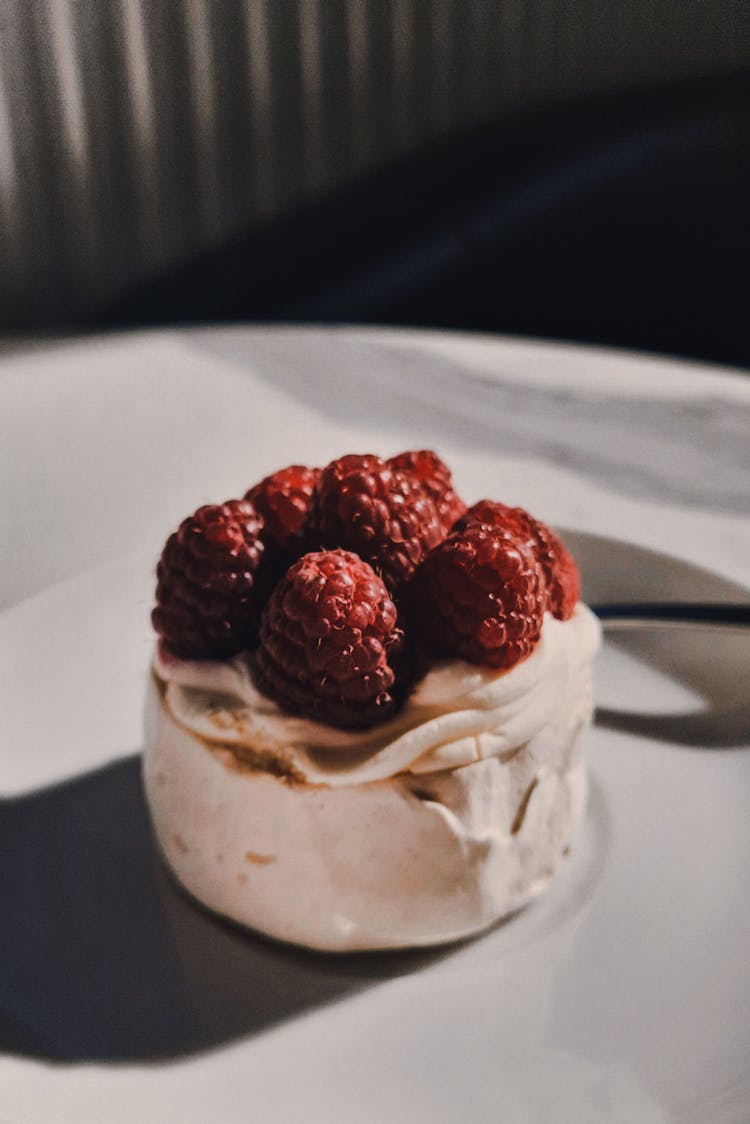 Close-Up Photo Of Raspberries On Cake