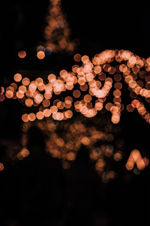 Free Warm bokeh light photograph capturing a cozy festive ambiance of blurred circles resembling a holiday scene. Stock Photo