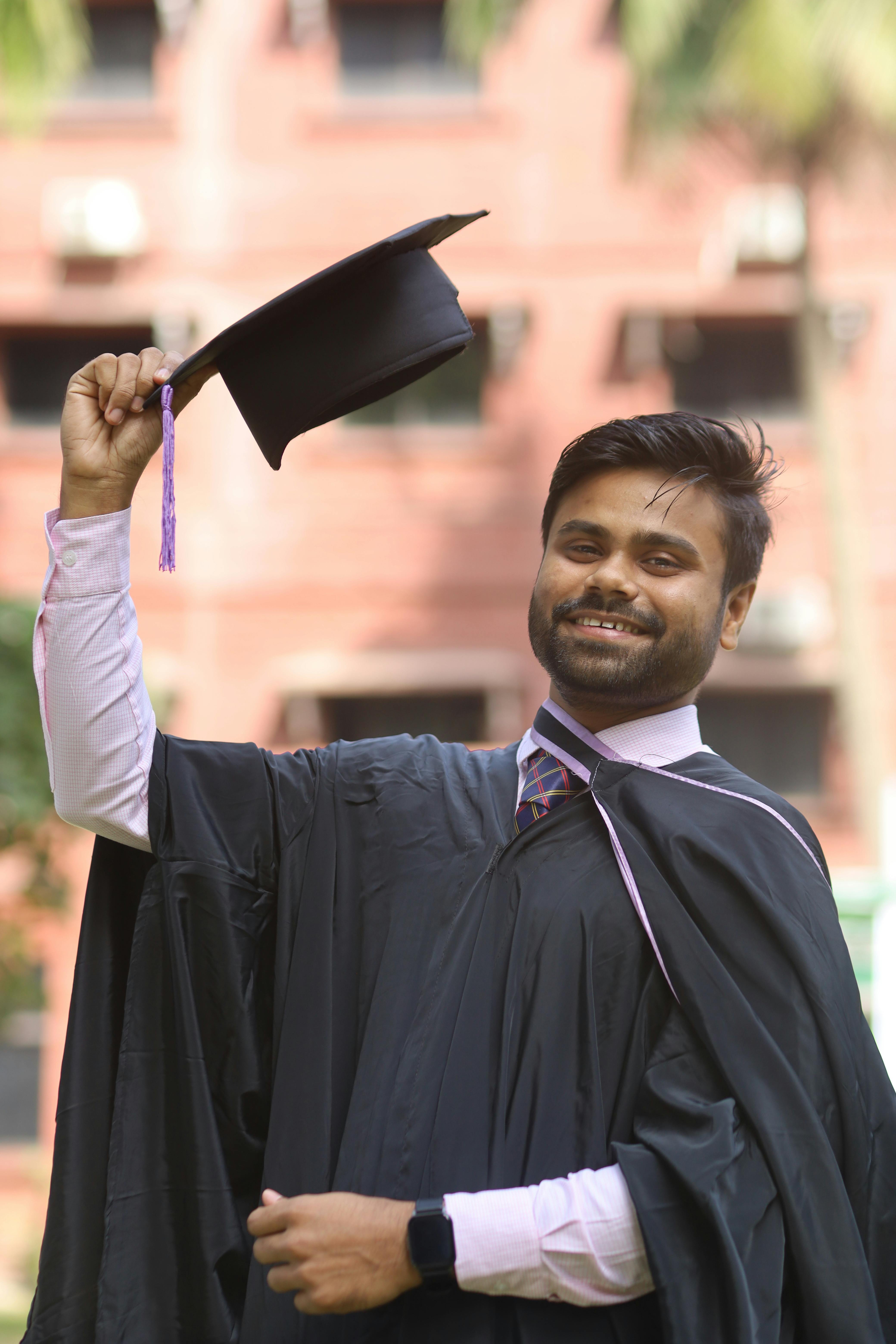 Young Male Graduate In Cap And Gown Stock Photo, Picture and Royalty Free  Image. Image 6189273.