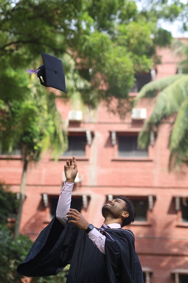 
Man Tossing Graduation Cap