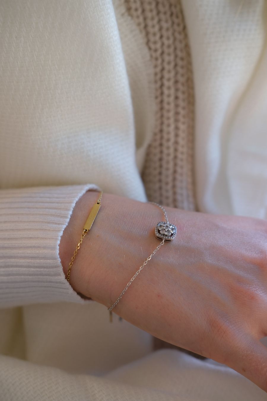 Wrist with gold and silver bracelets