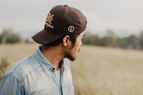 Selective Focus of Man Wearing Brown Cap