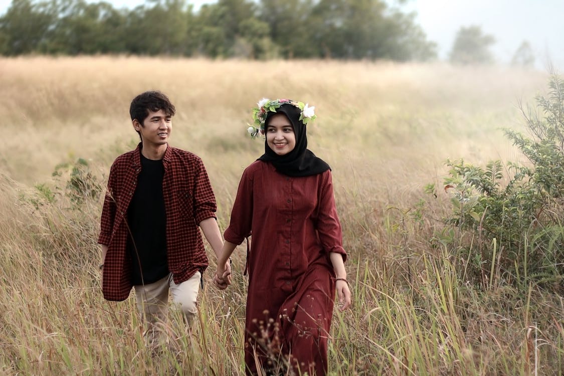 Man and Woman on Grass Field