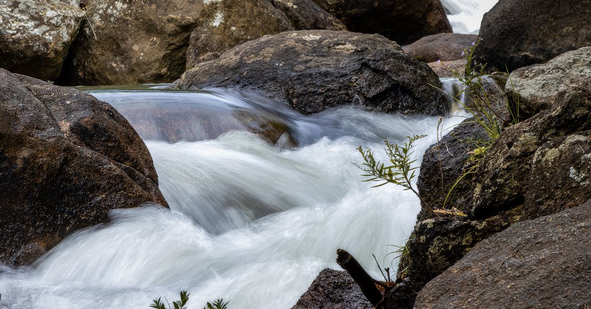Cascaded Rocks Long Exposure of a Cascade with Large Rocks · Free Stock Photo