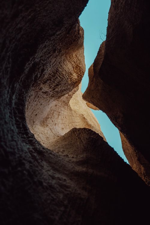 Free Low angle shot of unique rock formations in Nevşehir reveals a stunning blue sky Stock Photo
