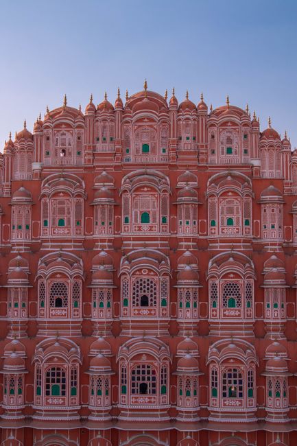 Iconic architecture of Hawa Mahal palace in Jaipur, showcasing its intricate pink sandstone facade.