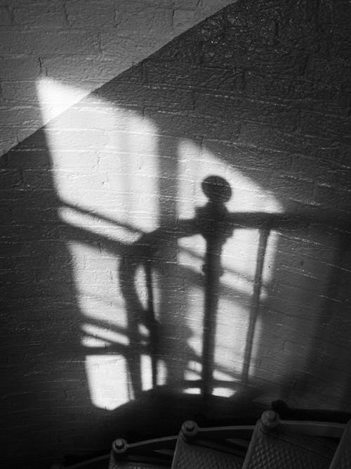 Shadow of the Stair's Handrail on the Brick Wall