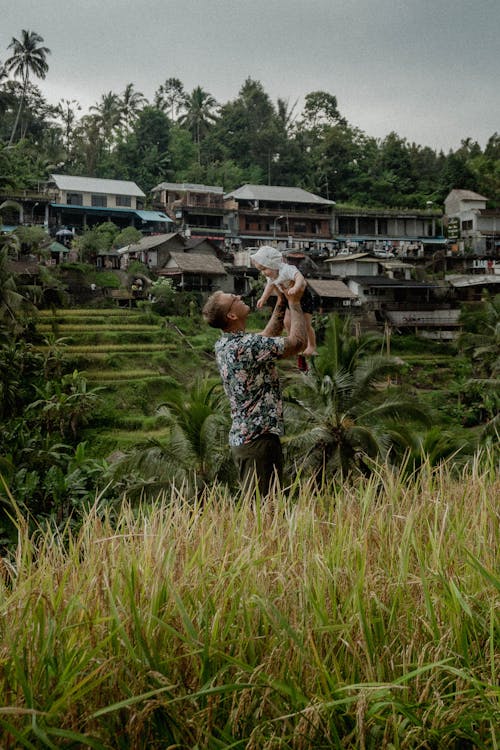 A Father with a Child in a Field 