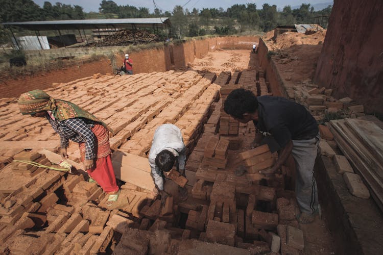 People Working In Brick Factory