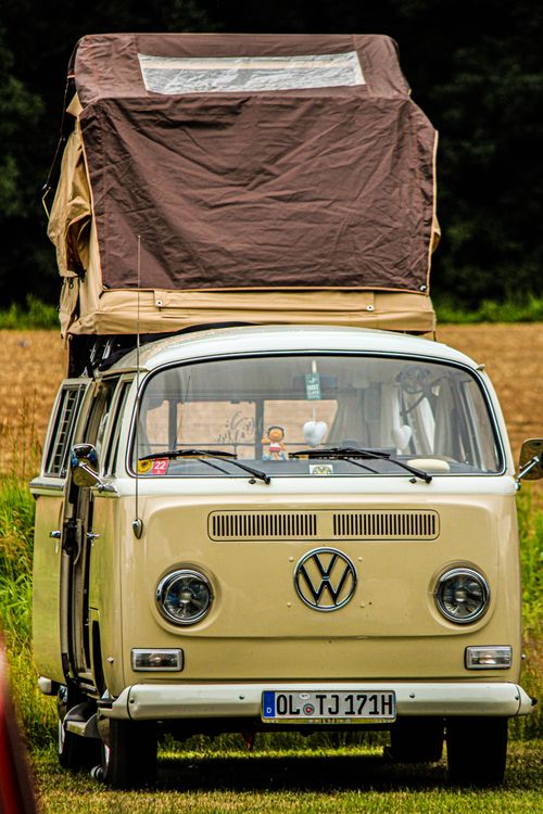 Free Classic Volkswagen van with pop-up tent roof parked outdoors near Oldenburg. Stock Photo