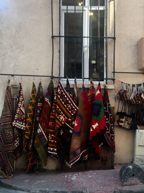 Free Colorful traditional textiles hanging in an Istanbul market, showcasing Turkish craft. Stock Photo