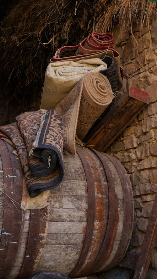 Rolled Mats on a Rusty Barrel