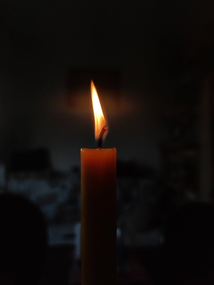 Close-Up Shot Of A Lighted Candle