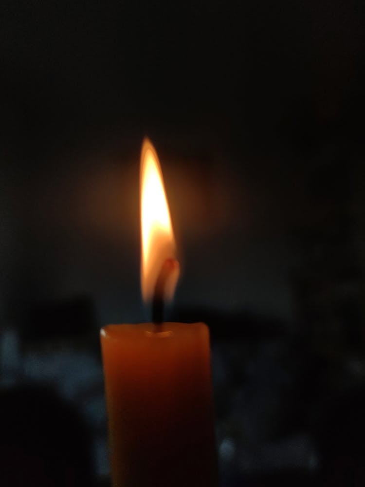 Close-Up Shot Of A Lighted Candle