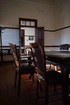 Sunlit room with elegant wooden furniture and a classic Turkish interior design.