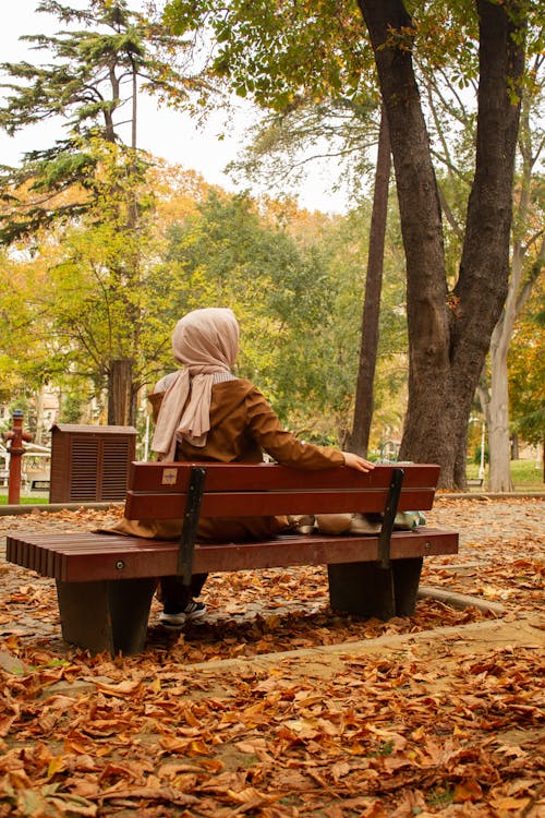 Woman in Hijab Sitting at Park in Autumn