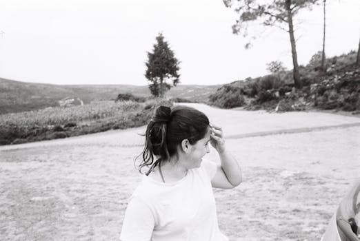 Artistic black and white portrait of a woman enjoying a day outdoors in Arouca, Portugal.