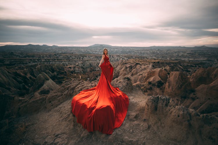 Woman In Red Dress Posing In Cappadocia