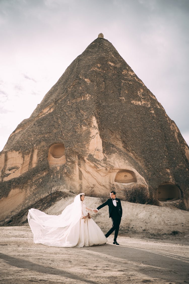 Newlyweds Together Near Ancient Ruins