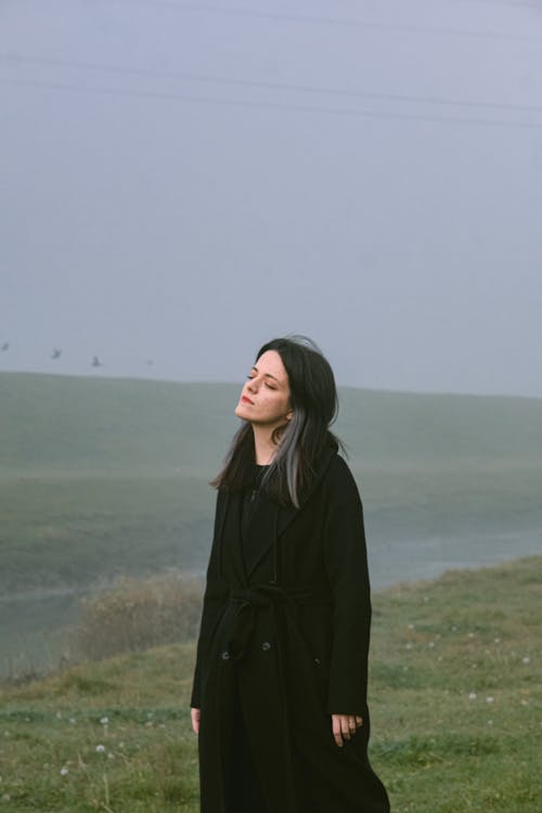 Portrait of a Woman Standing Outdoors