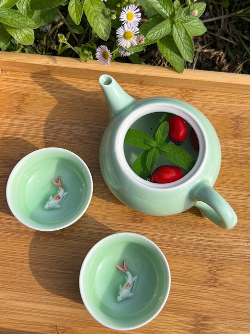 Ceramic Teapot with Berries in it and Two Cups 
