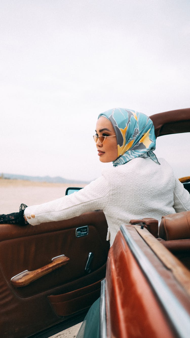 Woman In Hijab Entering Car