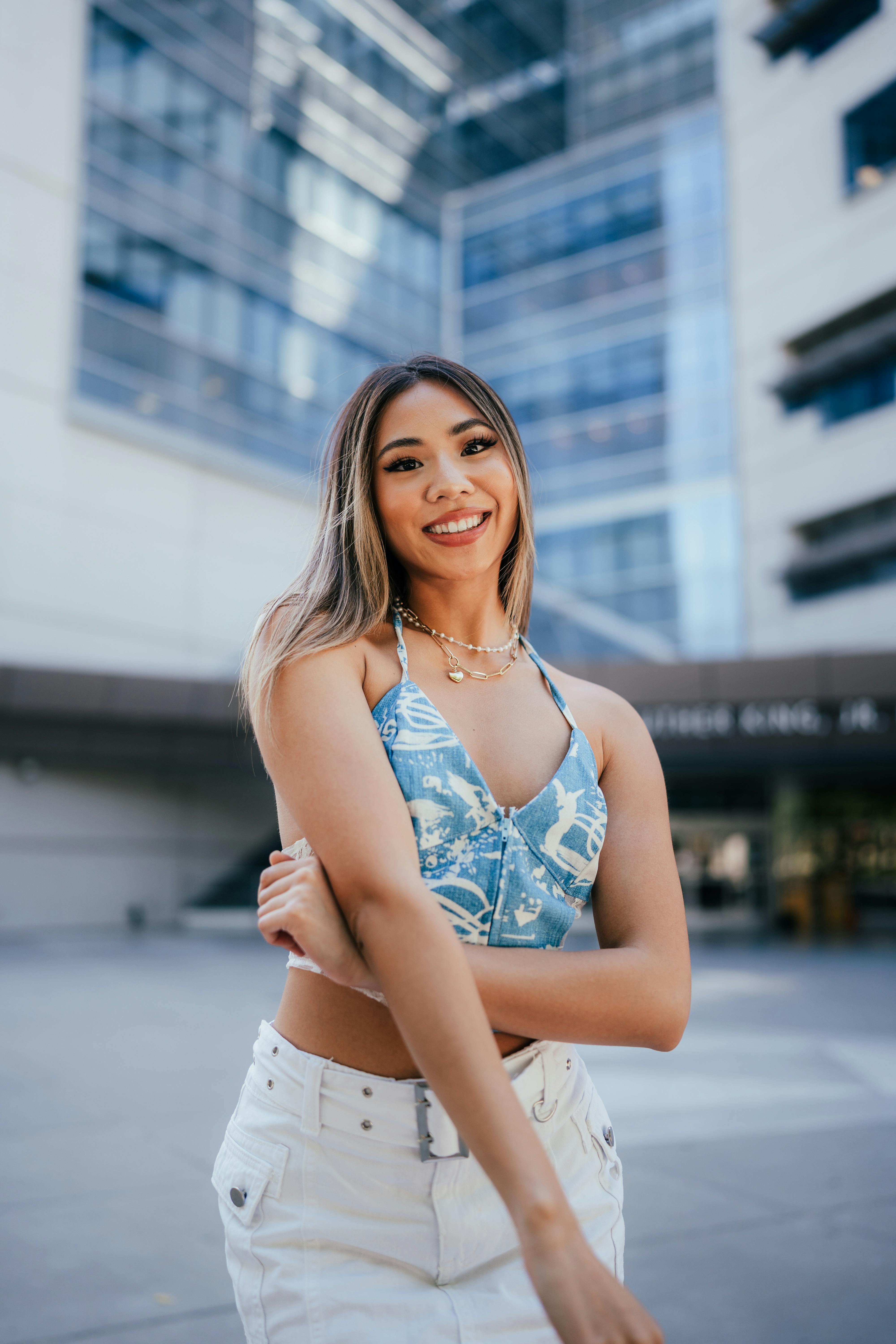 portrait of a woman smiling in a city