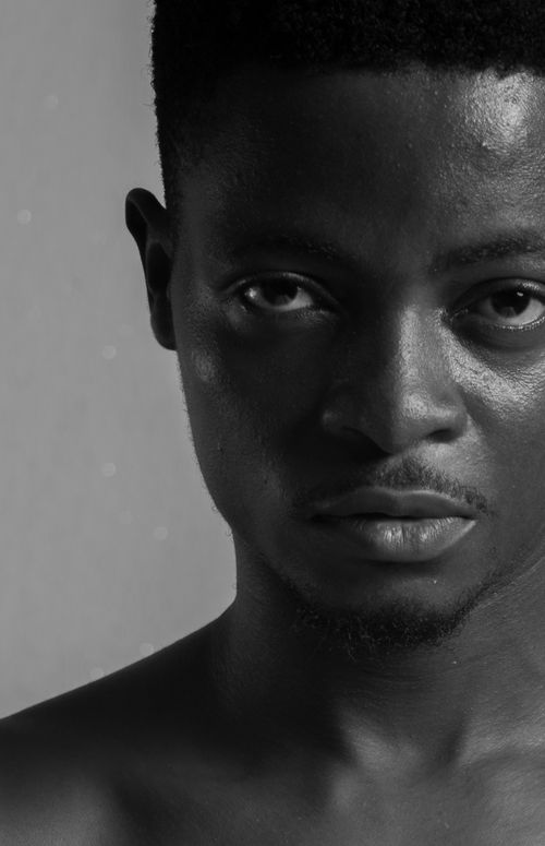 Free Dramatic black and white portrait of a man with an intense gaze. Stock Photo