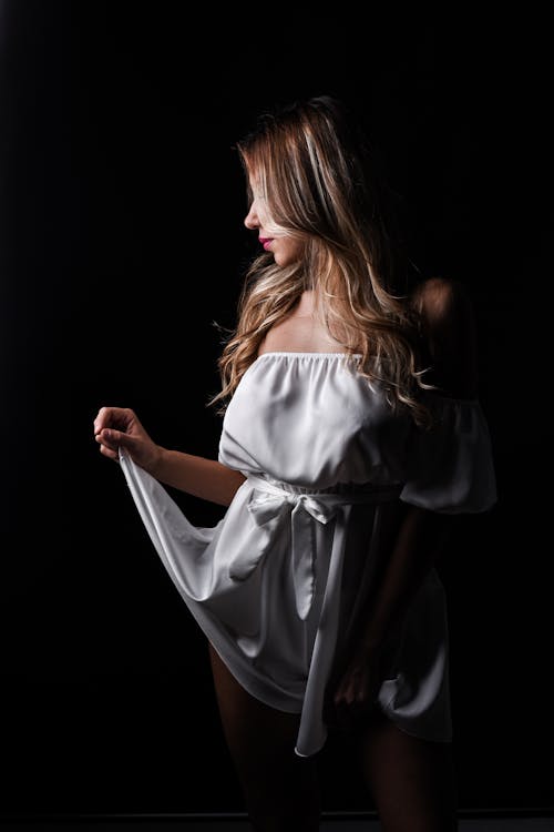 Woman in White Clothes Posing for Portrait