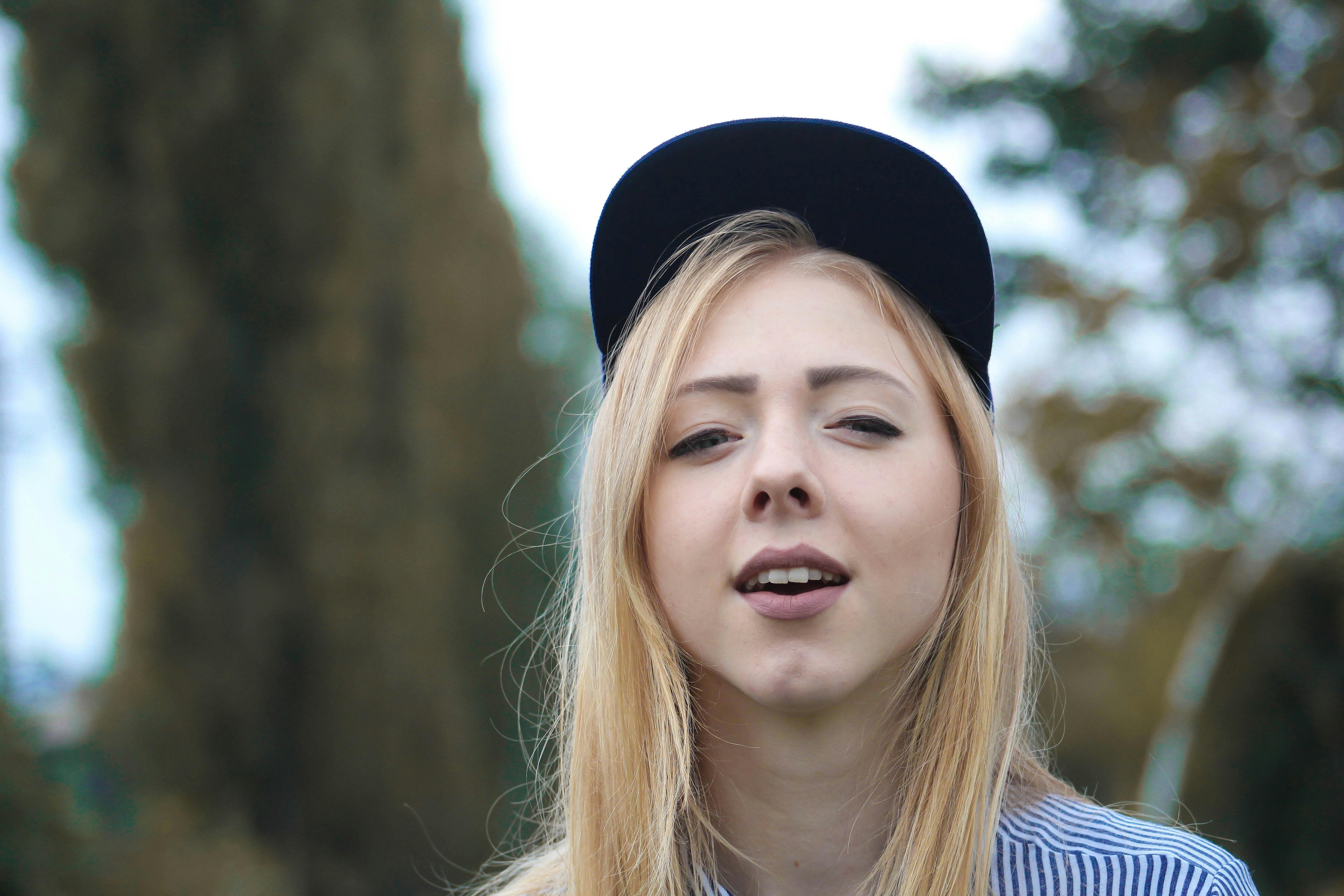 Close-Up Photo of Woman Wearing Hat · Free Stock Photo