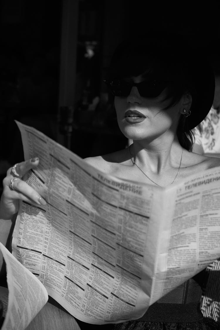 Seductive Woman Reading Newspaper