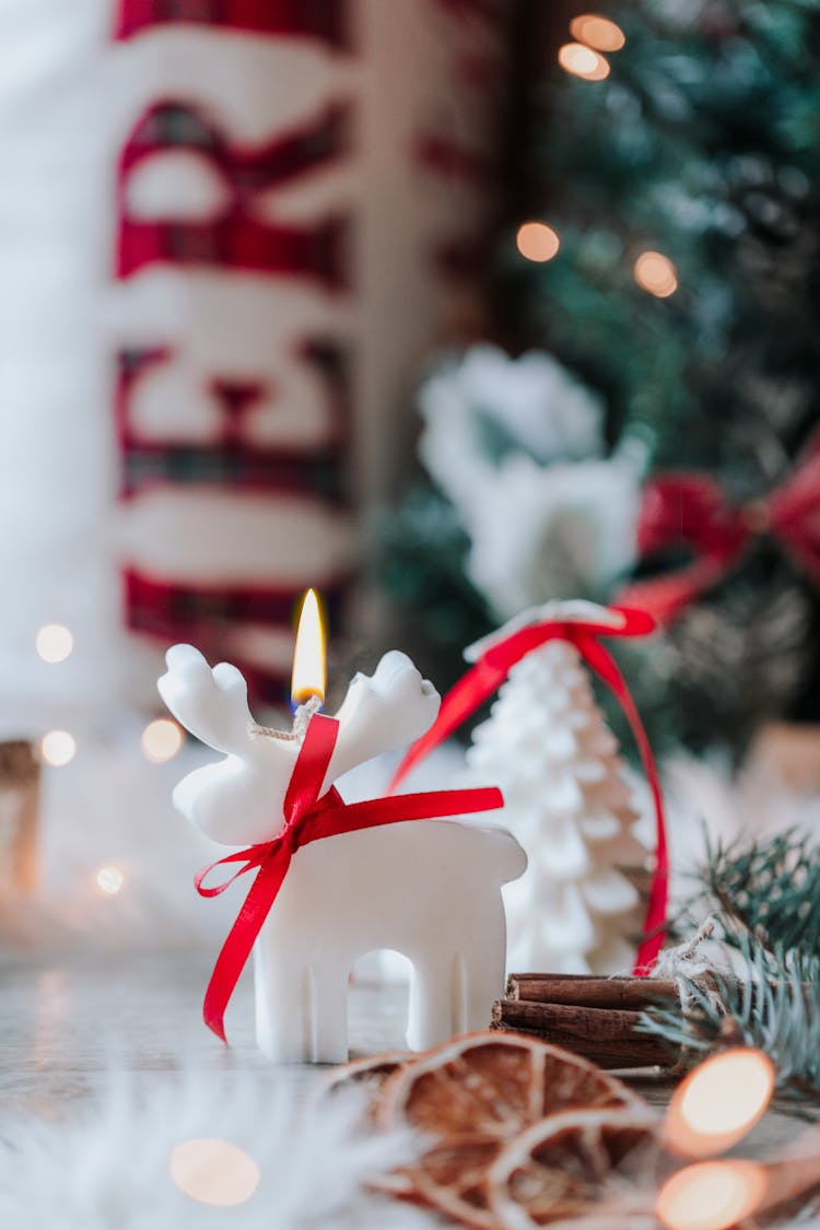 Close Up Of Christmas Decorations And Wax Candle