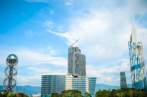 Free Stunning view of modern skyscrapers against a vibrant blue sky, showcasing urban architecture. Stock Photo