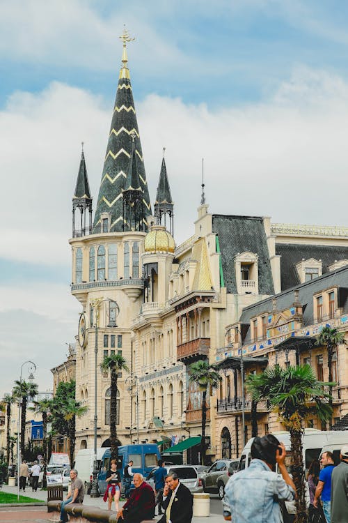 Clouds over Church near Street with Palm Trees