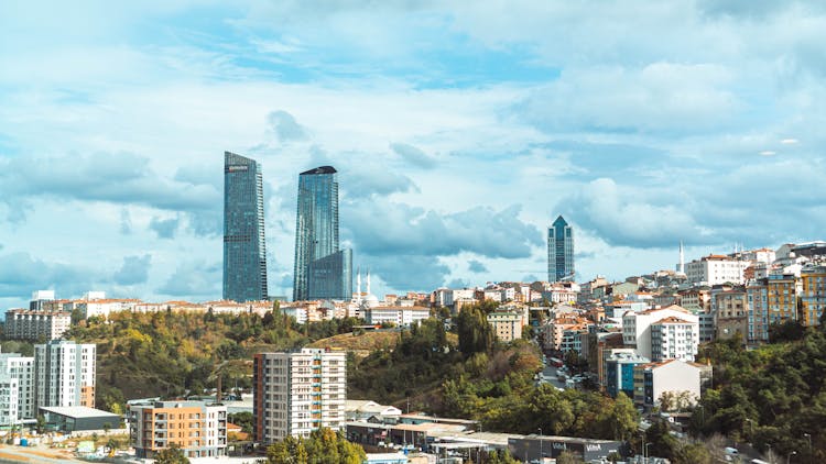 Glass Skyscrapers And Buildings On Blue Sky